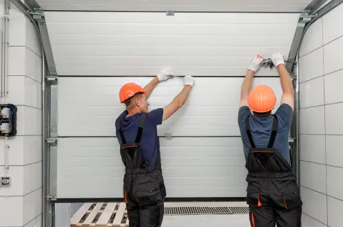 BT1 Doors installers adjusting a garage door